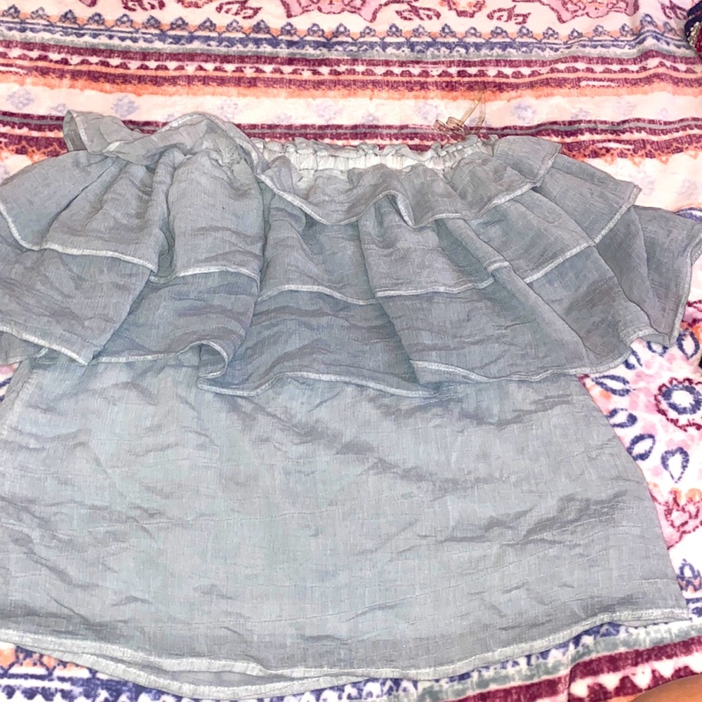 Dressy shirt with ruffles Color: kind of a cyan color it can be strapless